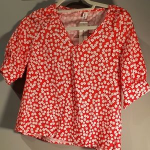 Red and white floral blouse